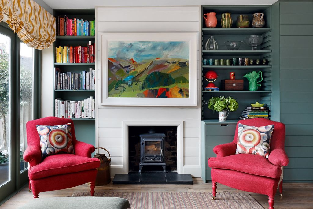 Image may contain Furniture Living Room Room Indoors Cushion Home Decor Interior Design Fireplace Hearth and Couch