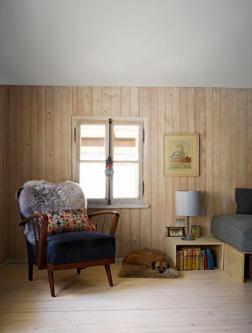 Image may contain Furniture Living Room Room Indoors Chair Interior Design Armchair and Wood