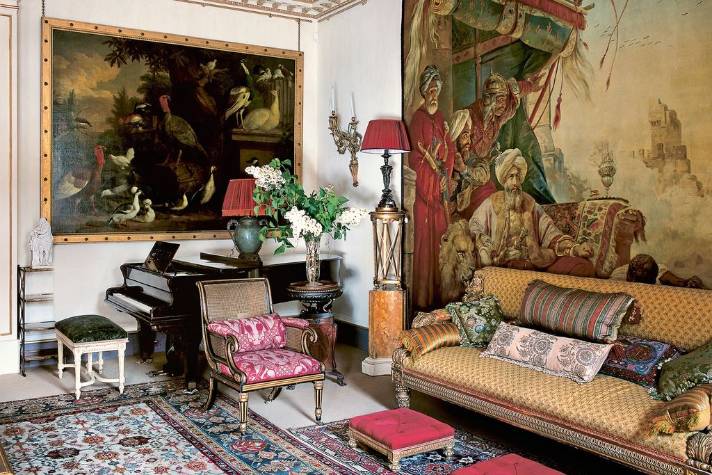 Image may contain Living Room Room Indoors Furniture Home Decor Couch Interior Design Human Person and Rug