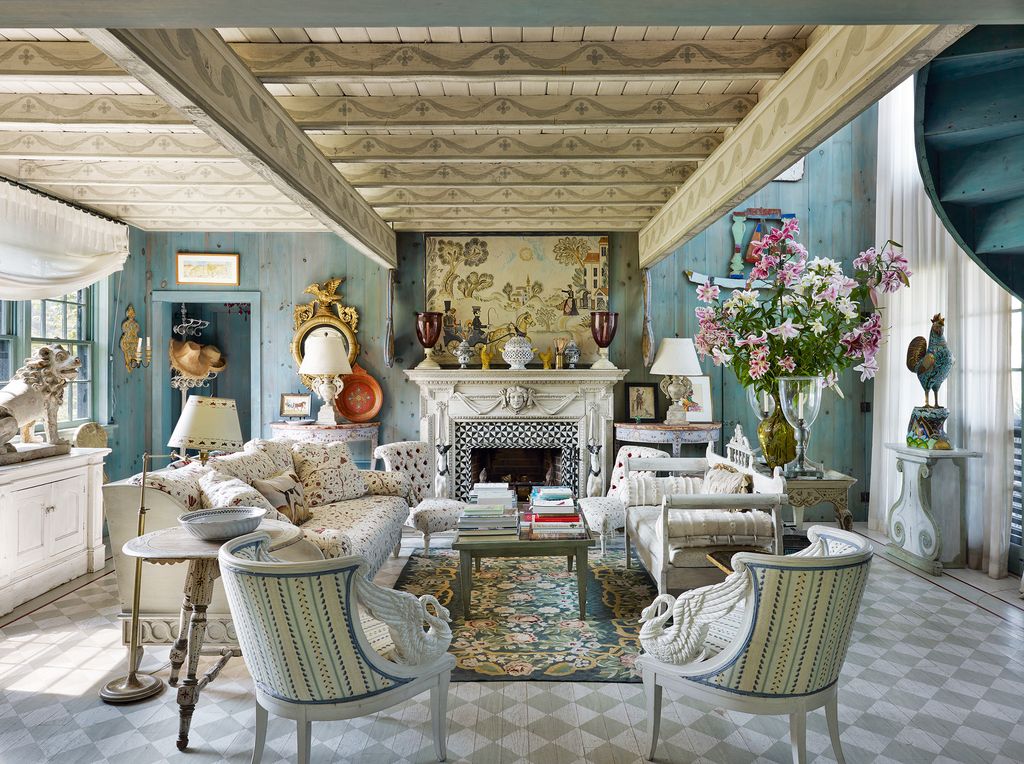 The interior of Pond House decorated by Genevieve Faure features an inviting combination of bluestained pine paneling...