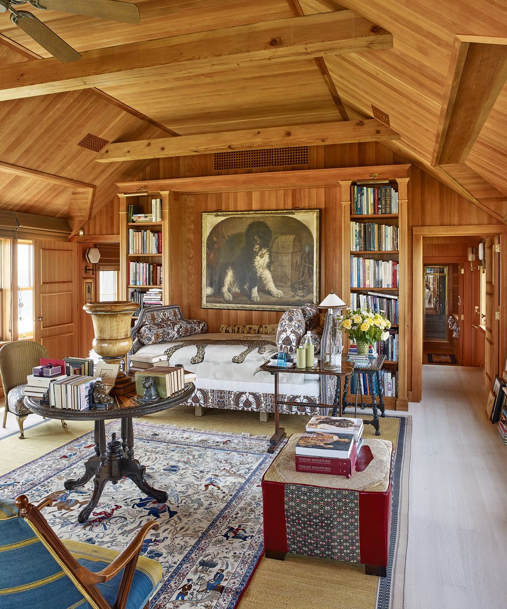 Image may contain Living Room Room Indoors Furniture Flooring Wood Housing Building Interior Design Lobby and Rug