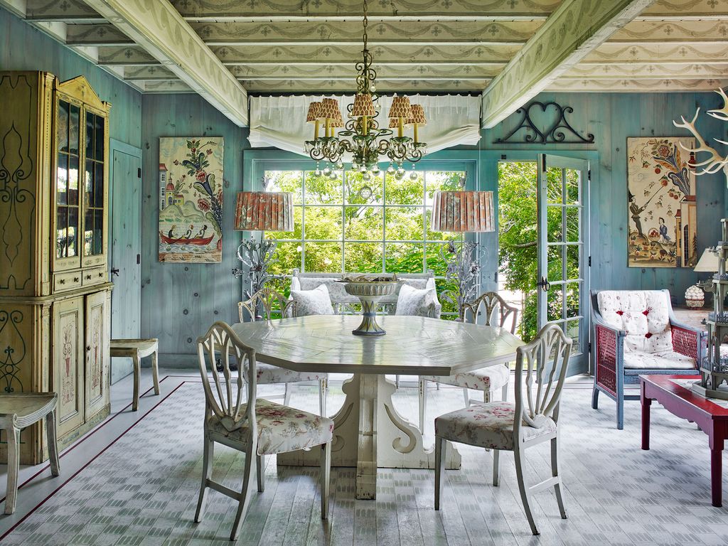 Image may contain Furniture Chair Room Indoors Dining Room Dining Table Table Porch and Interior Design