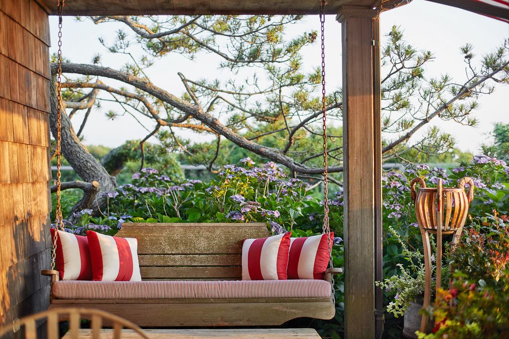 Image may contain Outdoors Garden Furniture Couch Patio and Plant