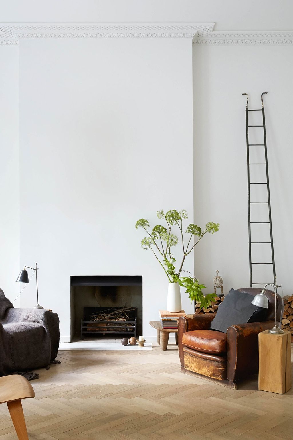 Image may contain Living Room Room Indoors Furniture Interior Design Fireplace Cushion Pillow Hearth and Couch