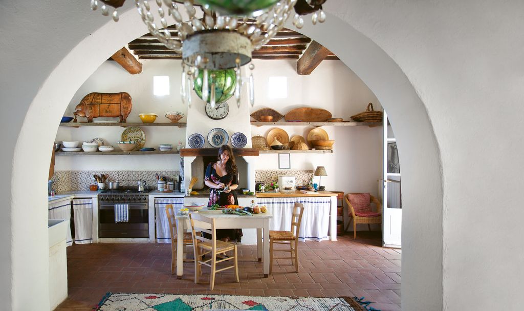 Image may contain Human Person Interior Design Indoors Room Flooring Wood Shelf Living Room Hardwood and Furniture