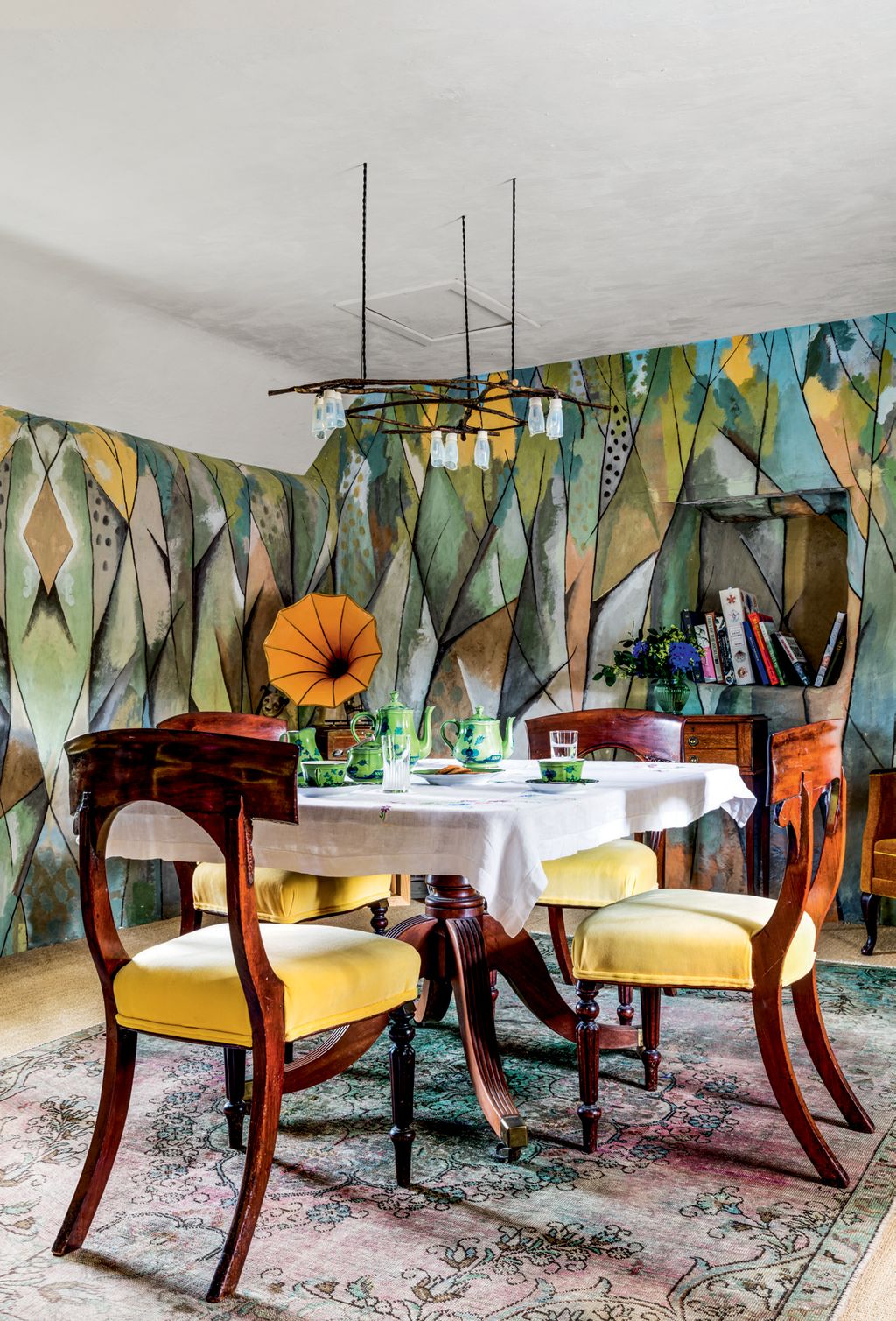 Image may contain Furniture Chair Home Decor Table Dining Table Restaurant Room Indoors Cafe and Tabletop
