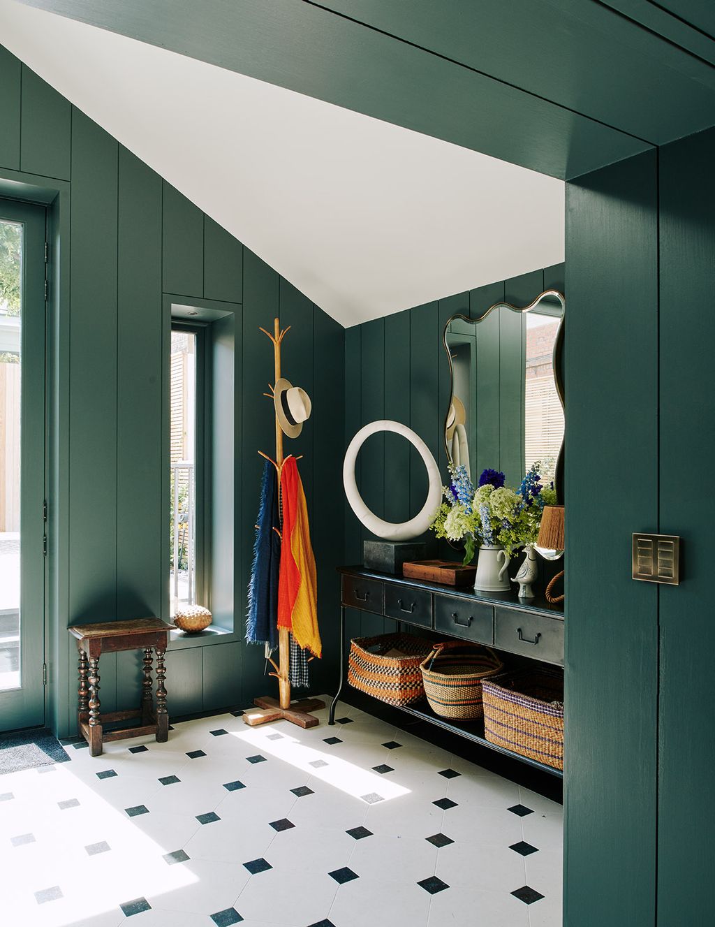 Image may contain Indoors Interior Design Room Flooring Living Room Plant Rug Flower Blossom Lobby and Home Decor