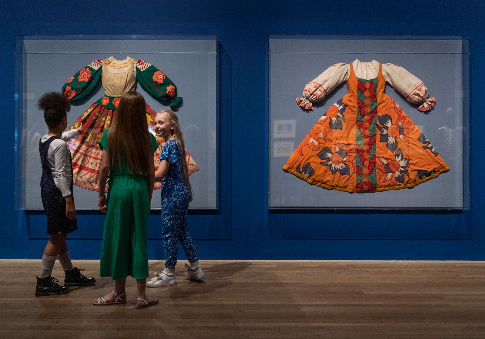 Image may contain Clothing Apparel Human Person Dance Pose Leisure Activities Wood Footwear Shoe and Evening Dress