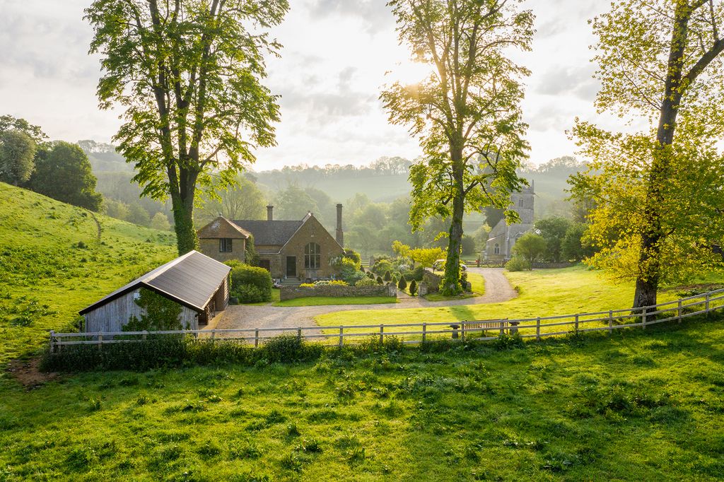 Image may contain Nature Outdoors Countryside Building Rural Grass Plant Housing Grassland Field Hut and Shelter