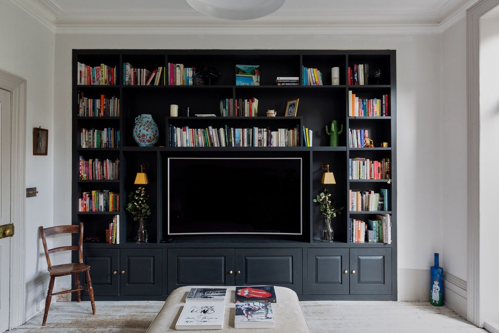 Image may contain Interior Design Indoors Electronics Entertainment Center Furniture Shelf Monitor and Display