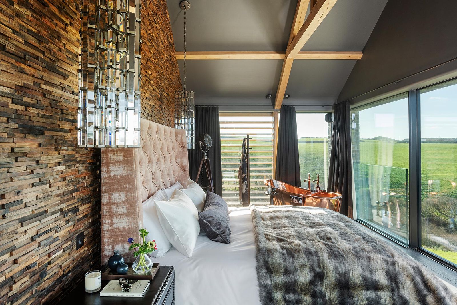 Image may contain Room Bedroom Indoors Interior Design Furniture Wood Living Room Bed and Dorm Room