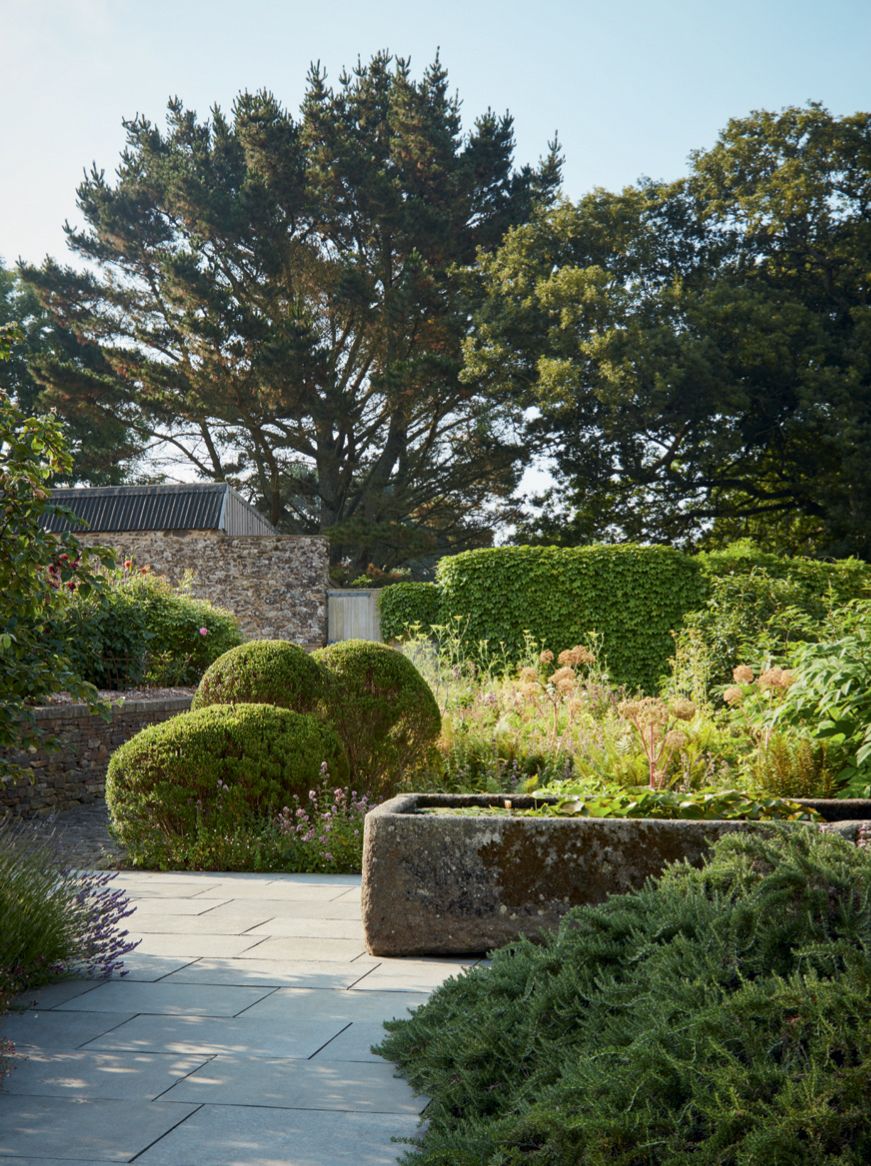 An old stone trough in this area is a nod to the sites agricultural heritage.