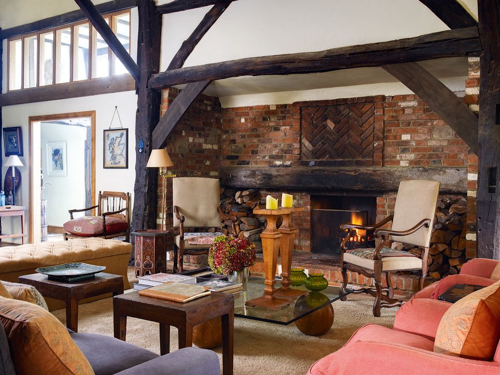 Image may contain Living Room Room Indoors Furniture Interior Design Couch Lobby and Fireplace