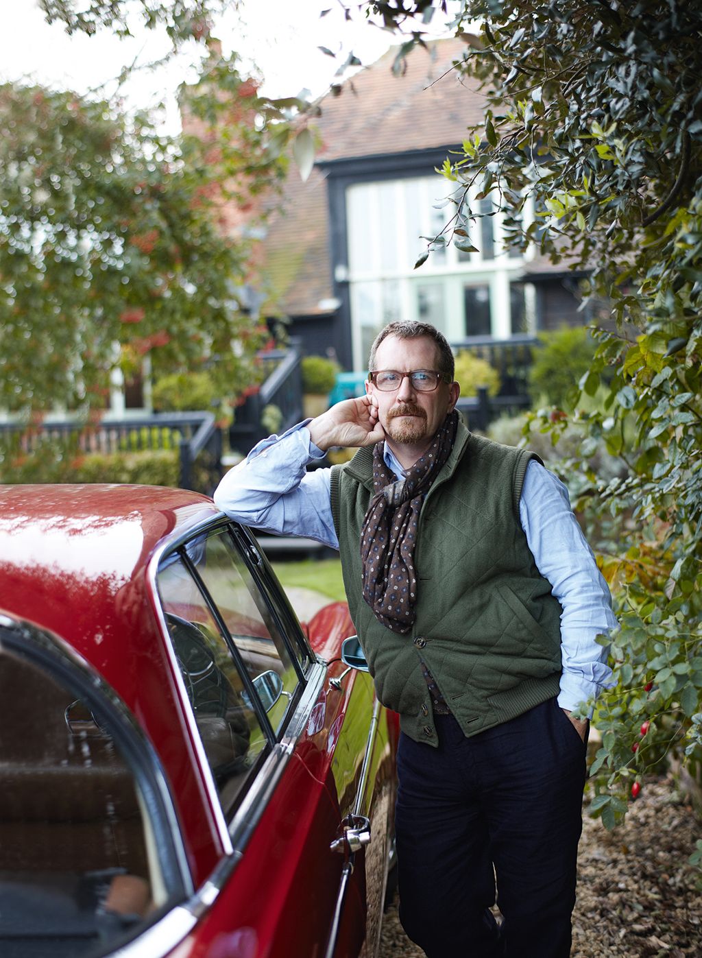 Image may contain Jacket Coat Clothing Apparel Human Person Vehicle Transportation Automobile Car and Sleeve