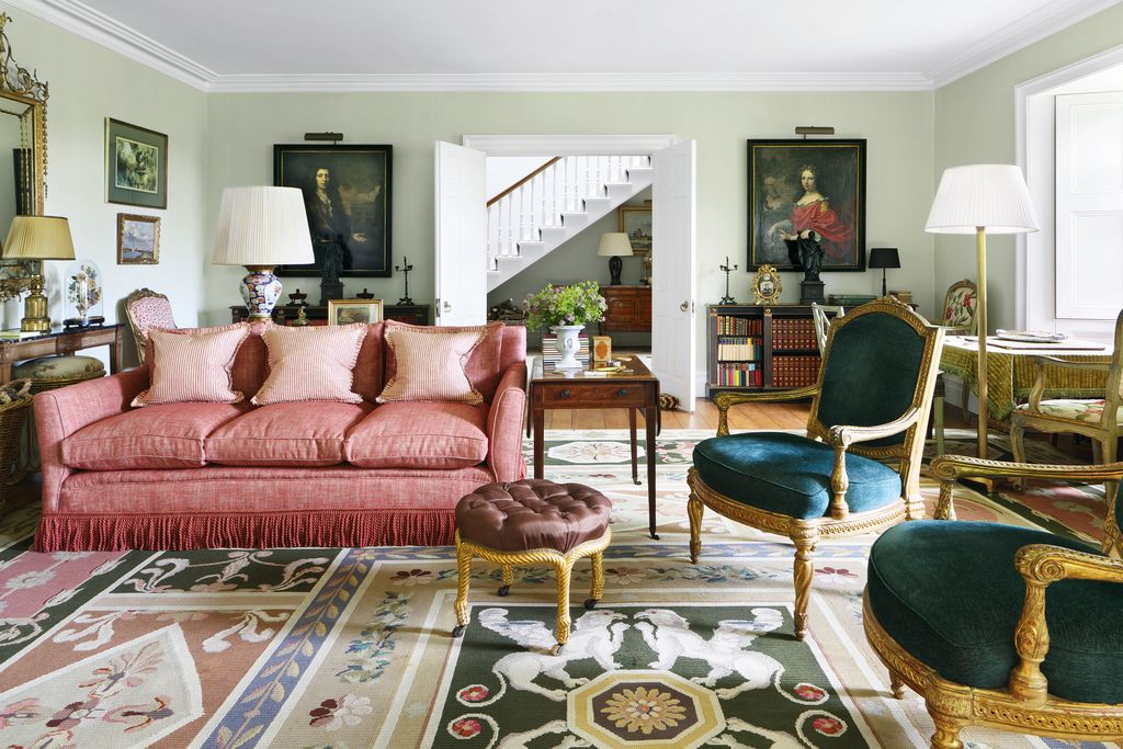 Image may contain Furniture Living Room Room Indoors Rug Couch Chair and Interior Design