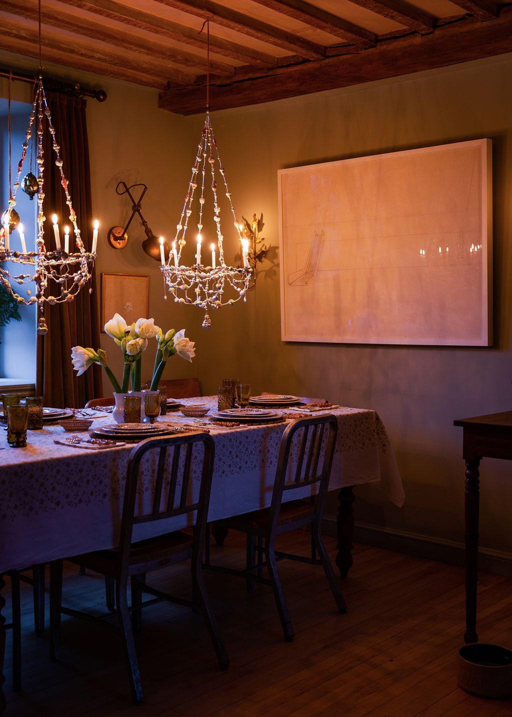 Image may contain Room Indoors Dining Room Furniture Chair Wood Dining Table Table Hardwood and Flooring