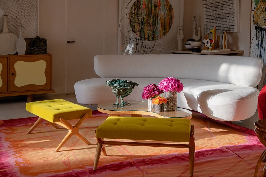 Image may contain Furniture Living Room Room Indoors Couch Table Wood Coffee Table Hardwood Flooring and Plywood