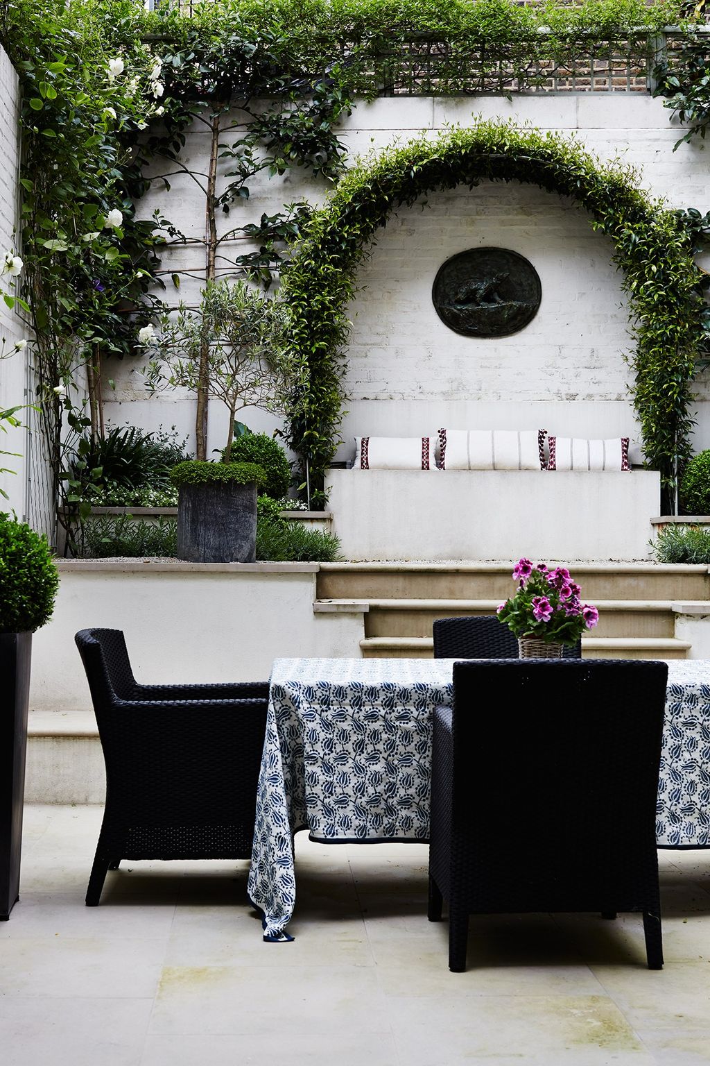 Image may contain Plant Furniture Chair Flower Blossom Flower Arrangement and Patio