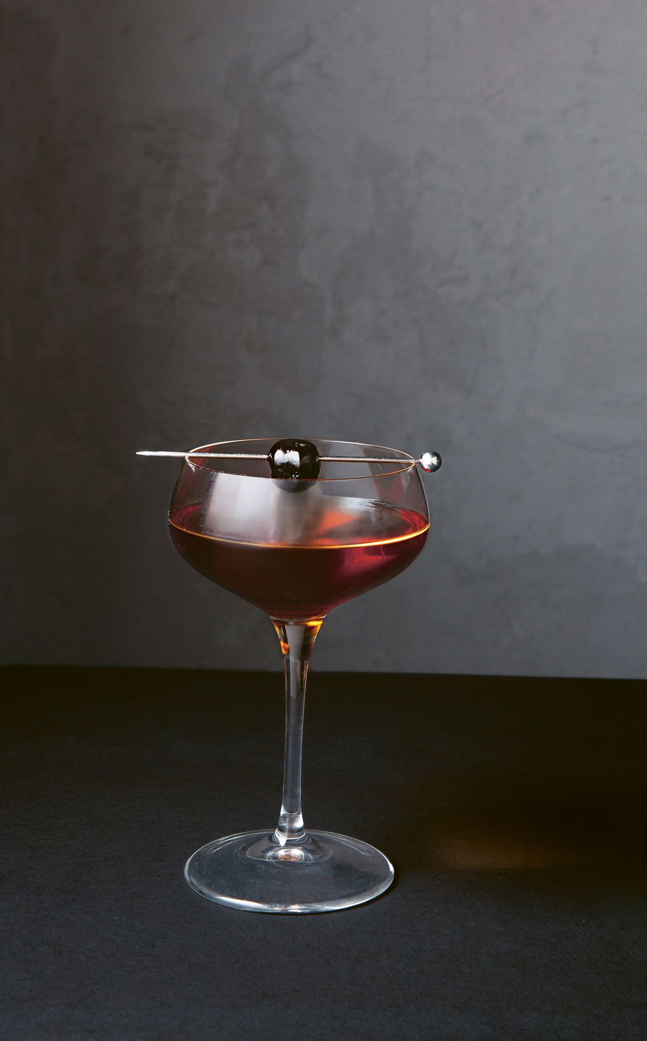 Image may contain Glass Goblet Drink Alcohol Beverage Wine Wine Glass and Lamp