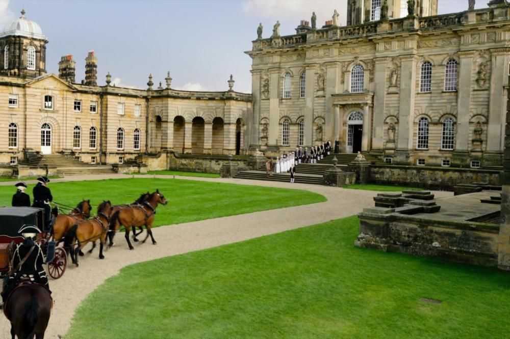 Image may contain Housing Mansion House Building Palace Architecture Animal Mammal Horse Human Person and Grass