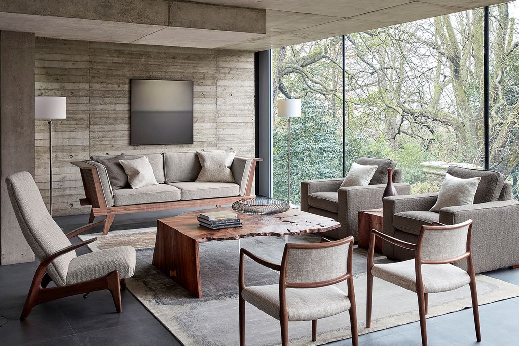 Image may contain Furniture Table Chair Coffee Table Tabletop Couch Living Room Room Indoors and Interior Design