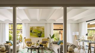 Image may contain Furniture Living Room Room Indoors Table Interior Design Flooring Chair Lobby and Couch