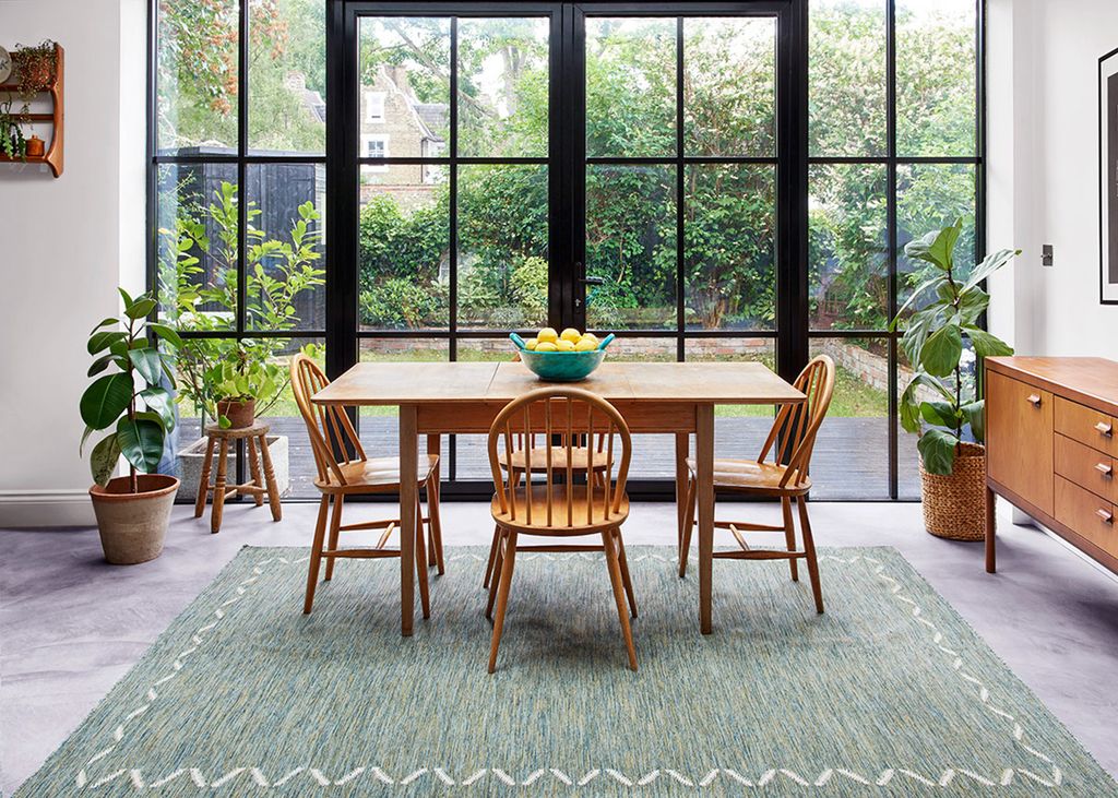 Image may contain Furniture Chair Table Dining Table Rug Indoors Room and Flooring