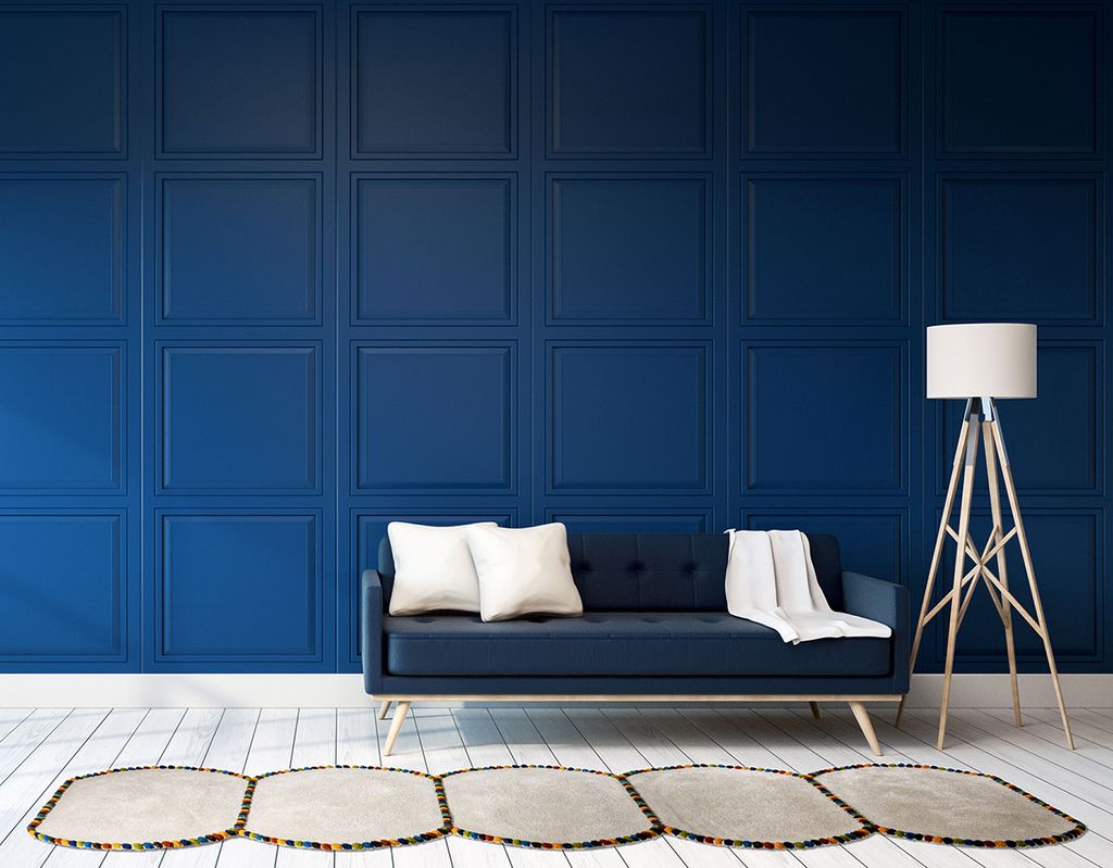 Image may contain Furniture Home Decor Couch Interior Design Indoors Corner Living Room Room Rug and Cushion