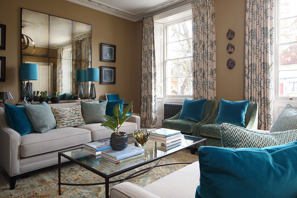 Image may contain Book Furniture Table Living Room Indoors Room Coffee Table Couch Rug Interior Design and Cushion