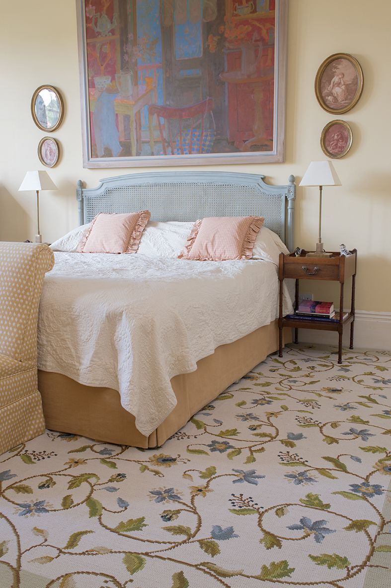 Image may contain Indoors Room Bedroom Furniture Rug Bed Dorm Room Building Clock Tower Architecture and Tower