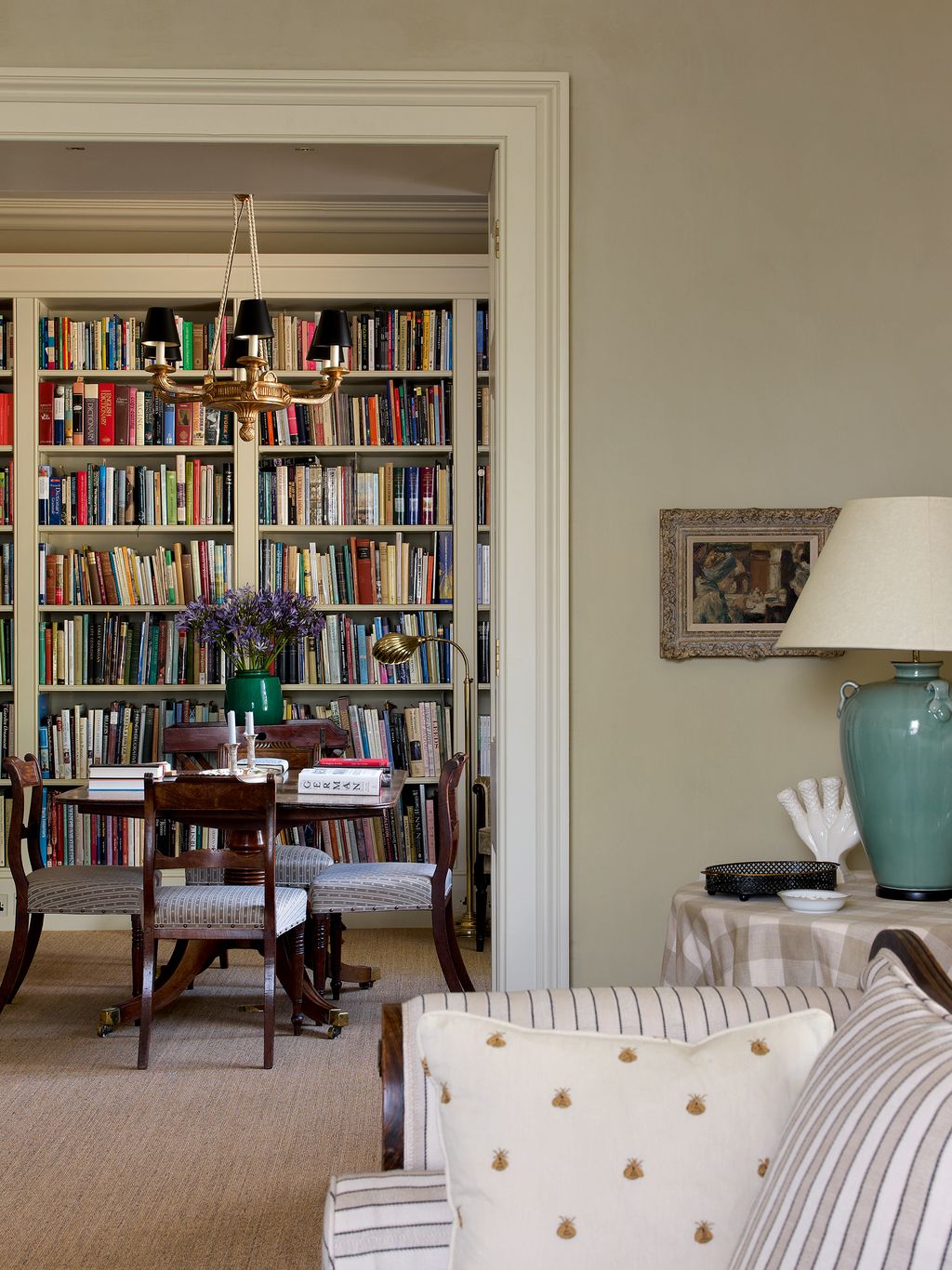 Image may contain Furniture Bookcase Shelf Chair Indoors Room Couch and Living Room