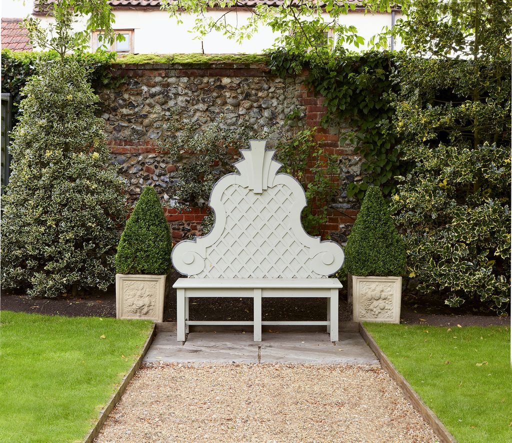 Image may contain Plant Grass Furniture Outdoors Flagstone Garden Arbour and Lawn