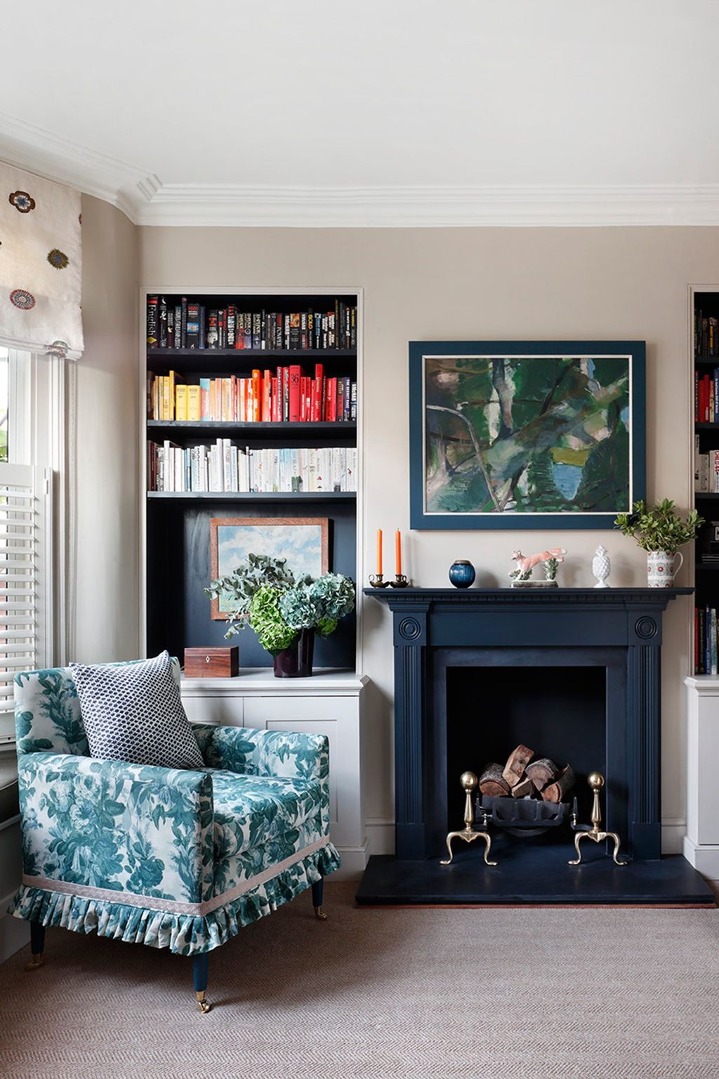 Image may contain Furniture Indoors Living Room Room Interior Design Couch Cushion Hearth and Fireplace