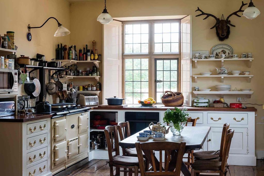 Image may contain Furniture Chair Room Indoors Shelf Wood Interior Design Kitchen Island and Kitchen