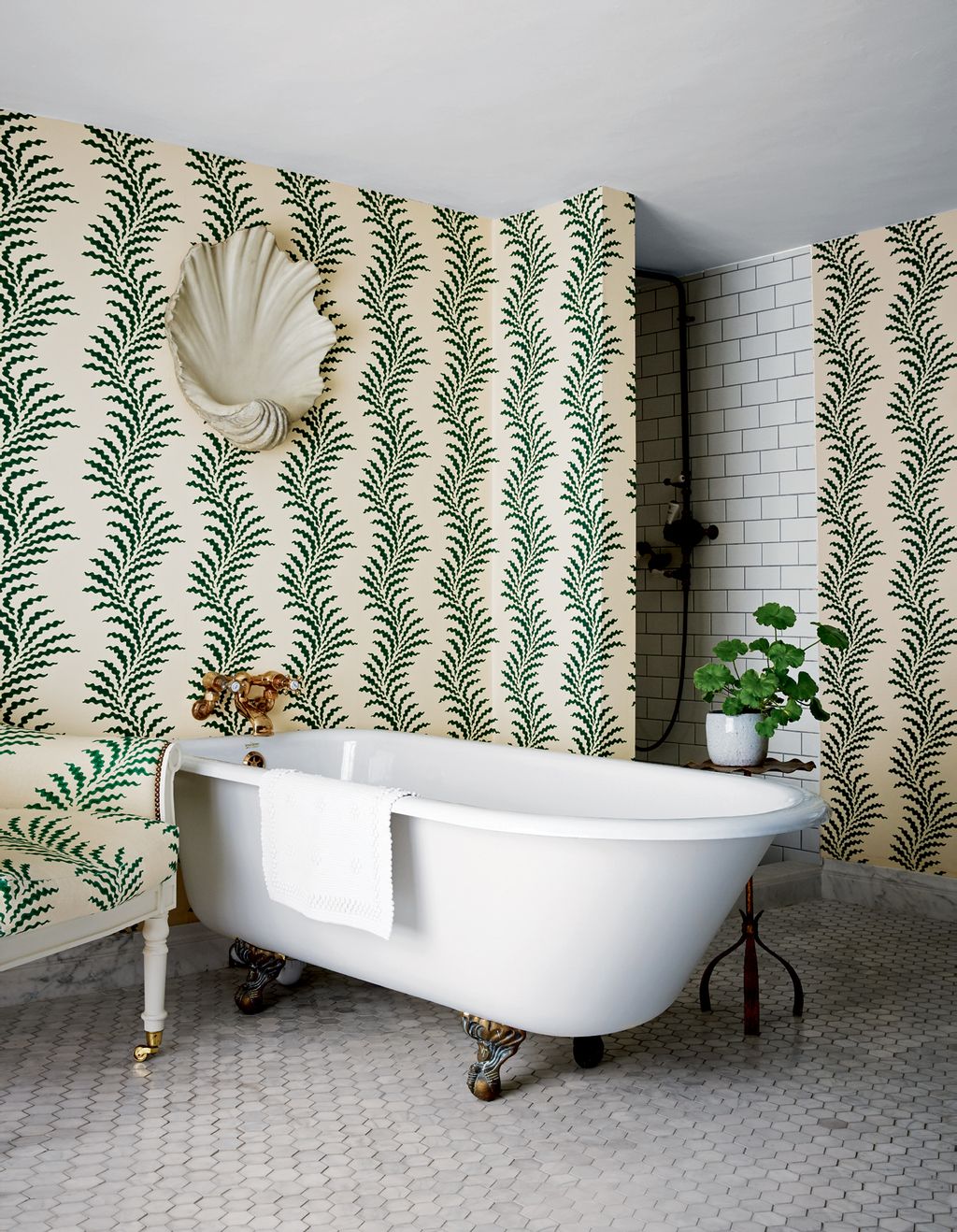 Katharine fell in love with Soanes ‘Scrolling Fern Frond wallpaper before she bought the house. The bath is from a...