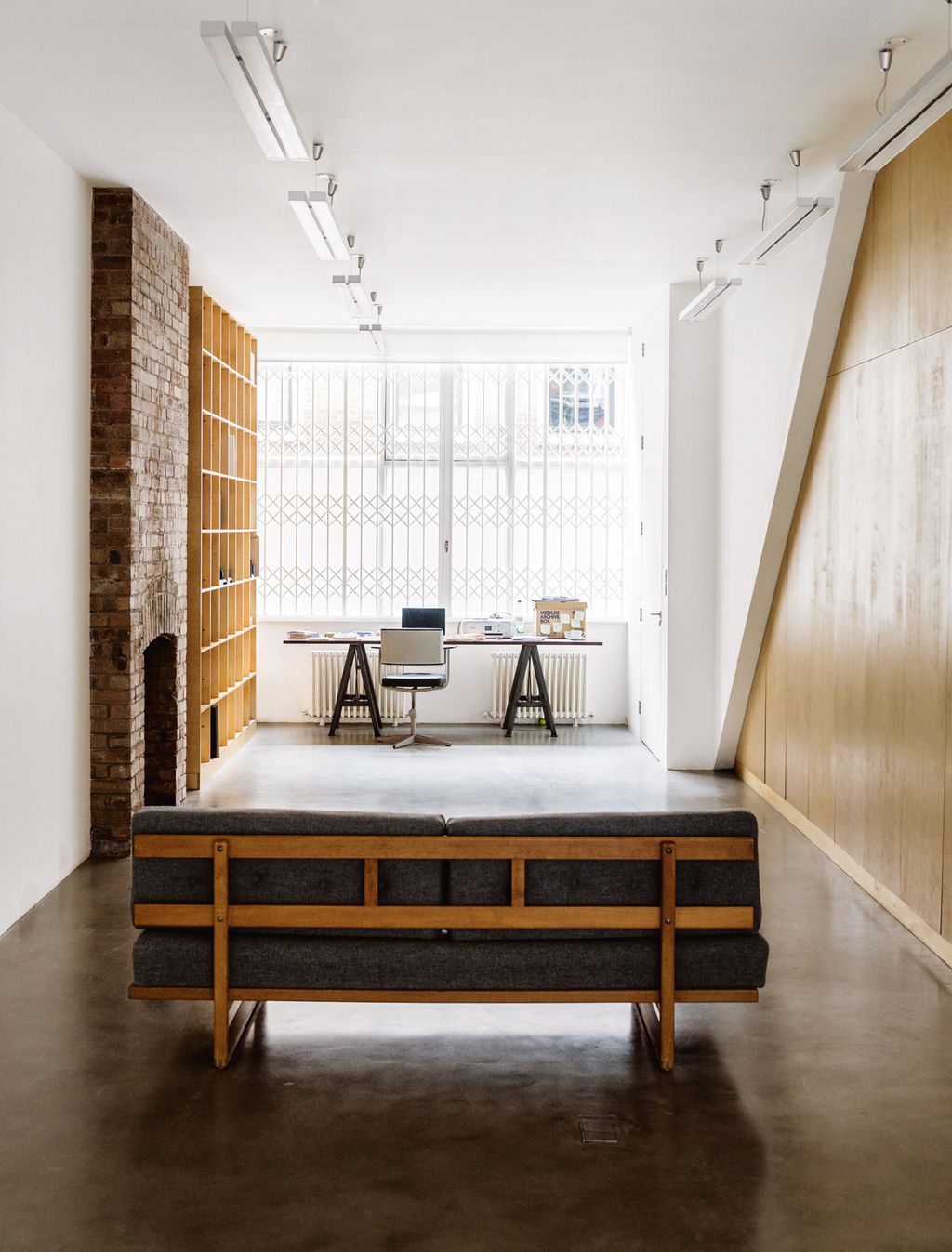 Image may contain Wood Floor Furniture Hardwood Flooring Lighting Interior Design Indoors Plywood and Sideboard