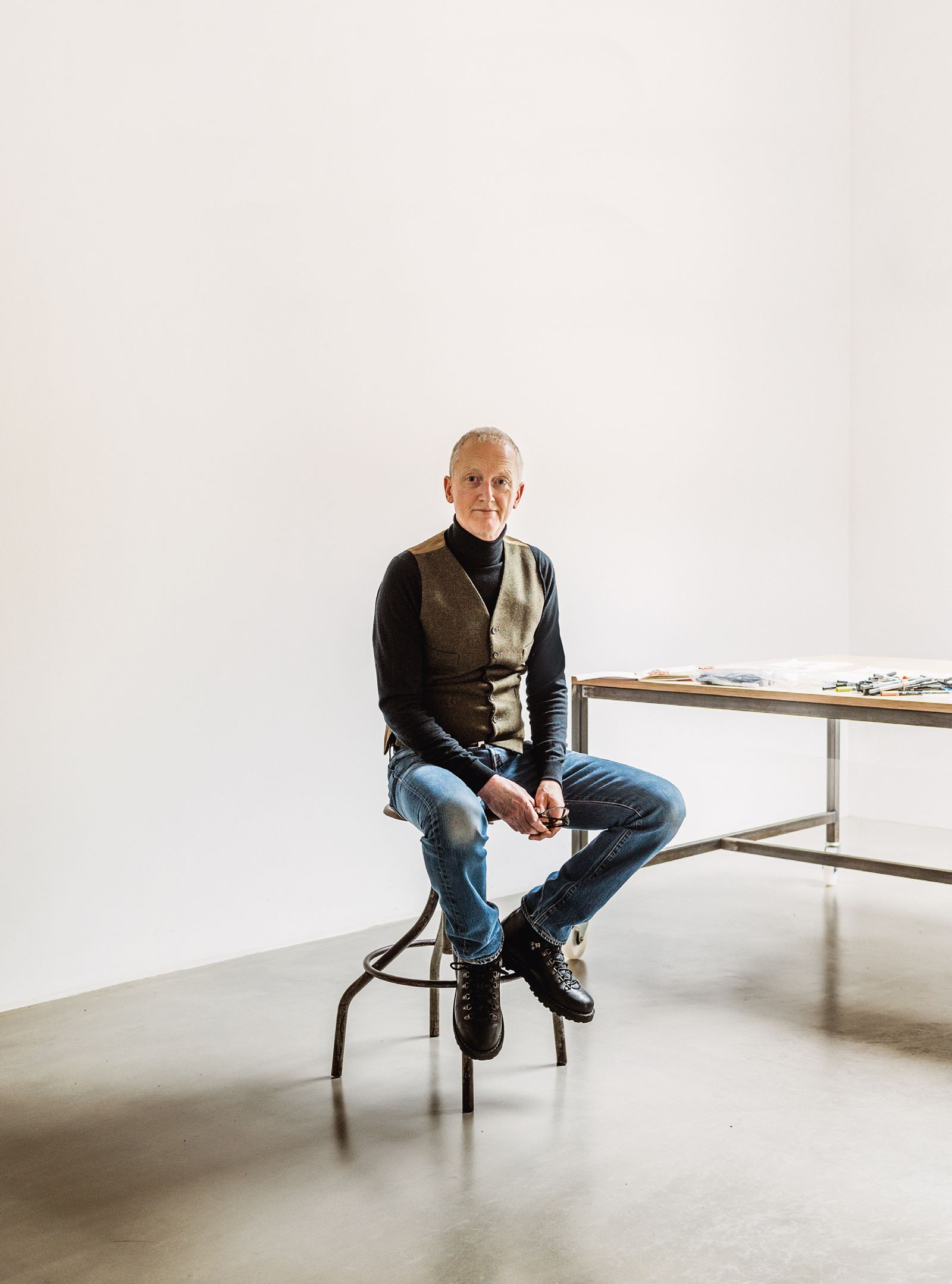 Image may contain Footwear Clothing Shoe Apparel Sitting Human Person Michael Landy Furniture Tabletop and Table