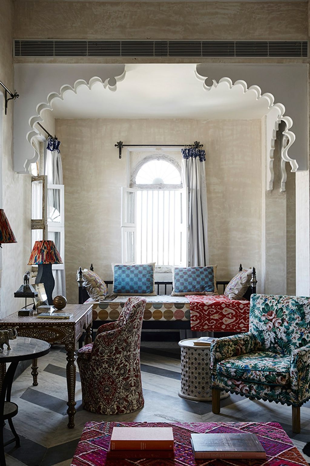 Image may contain Living Room Room Indoors Furniture Couch Table Interior Design Cushion and Chair