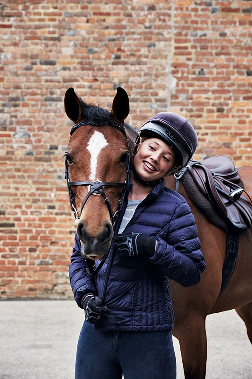 Image may contain Clothing Apparel Helmet Human Person Animal Mammal Horse Footwear Riding Boot Boot and Brick