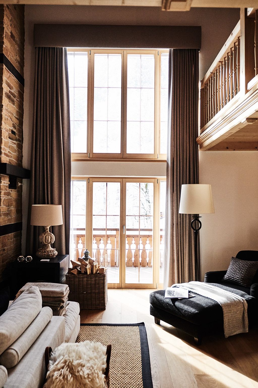 Image may contain Furniture Living Room Room Indoors Couch Rug Cushion and Pillow