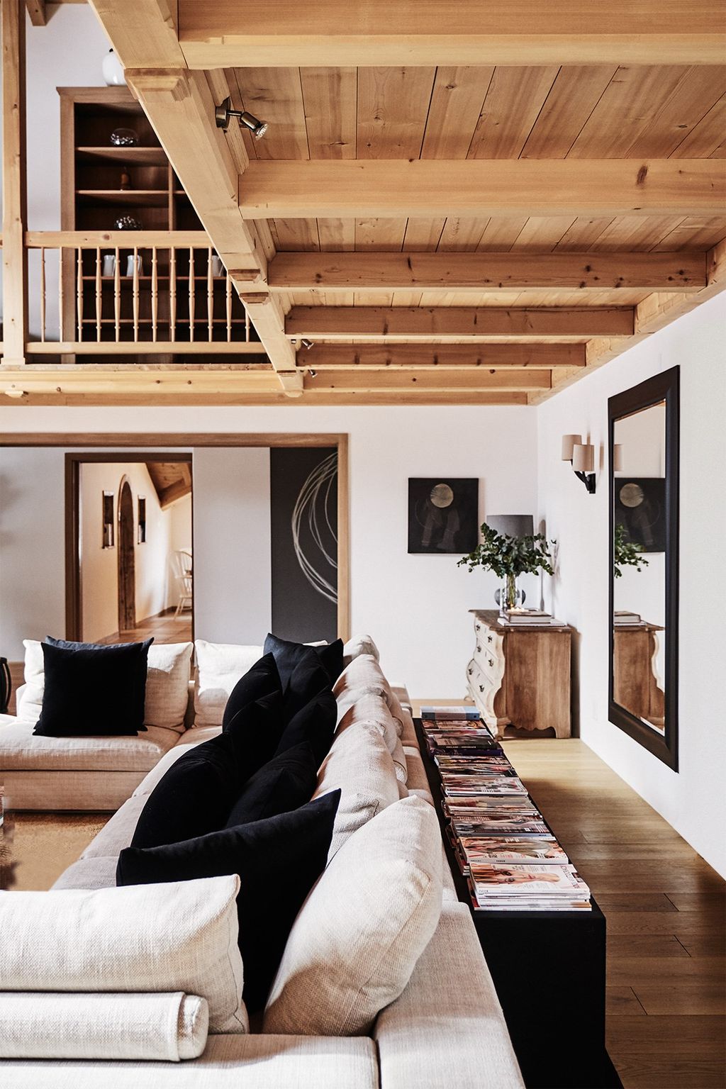 Image may contain Living Room Room Indoors Interior Design Furniture Couch Housing Building Flooring and Wood