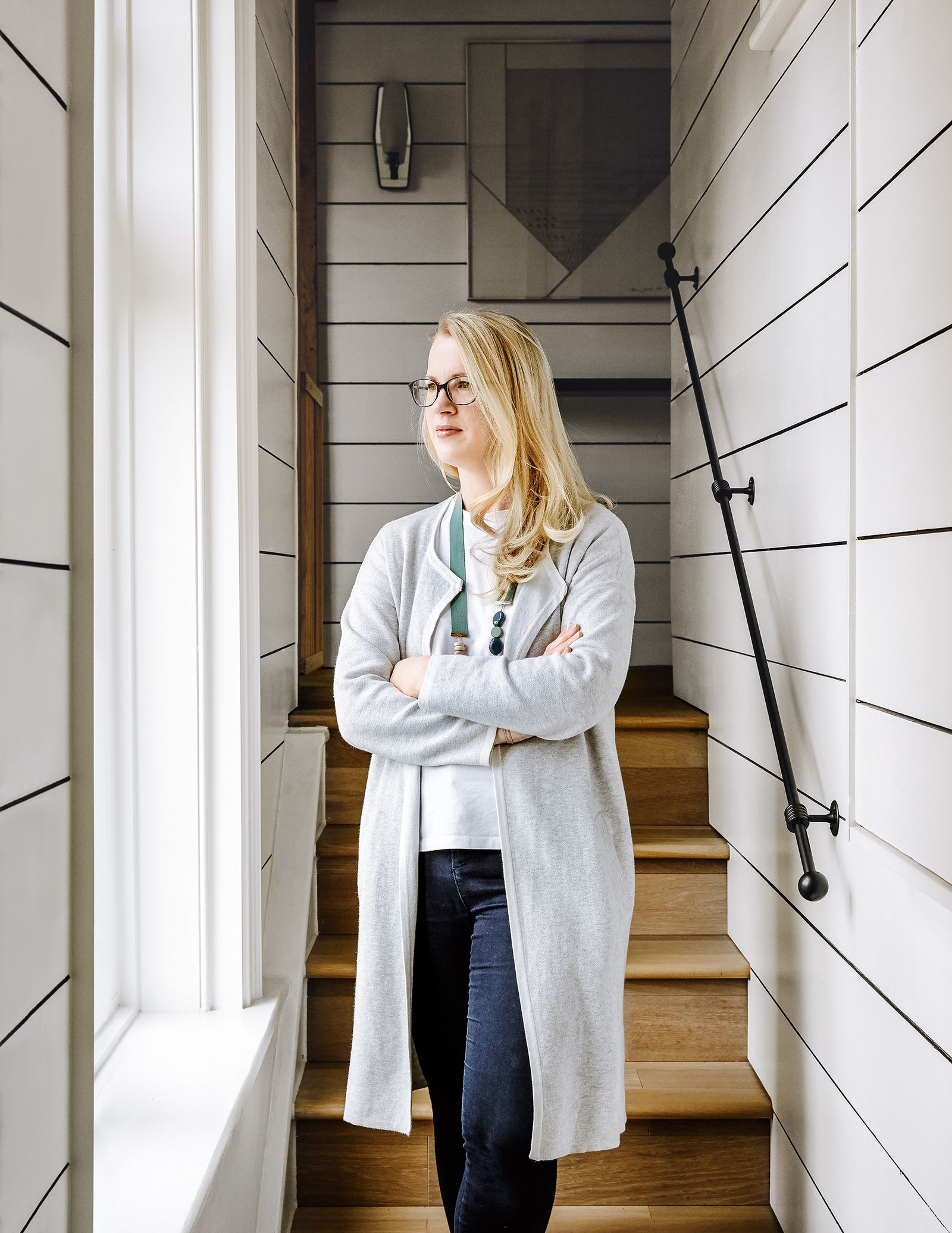 Image may contain Clothing Apparel Sleeve Coat Human Person Overcoat Banister Handrail Long Sleeve and Home Decor