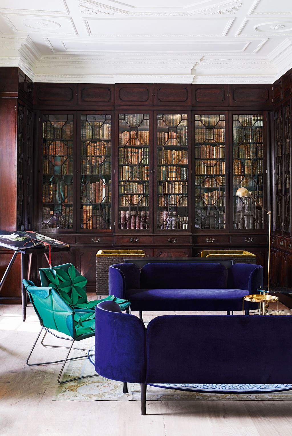 Image may contain Indoors Room Furniture Library Book Chair Couch and Interior Design