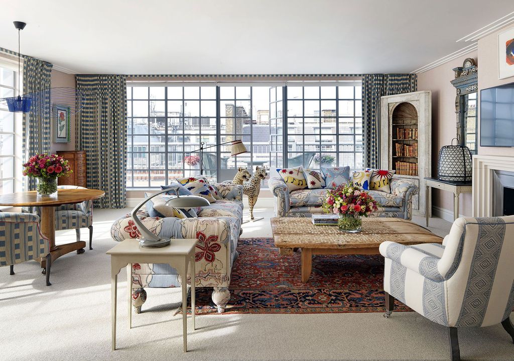 Image may contain Living Room Room Indoors Furniture Couch Table Coffee Table Rug and Flooring