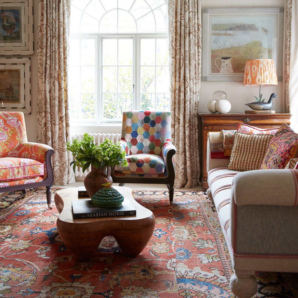 The curtains in Kit's drawing room are in a Robert Kime fabric.