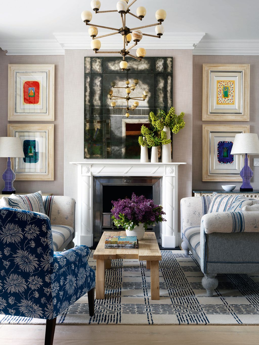 Image may contain Living Room Room Indoors Furniture Couch Interior Design Rug Table Home Decor and Coffee Table