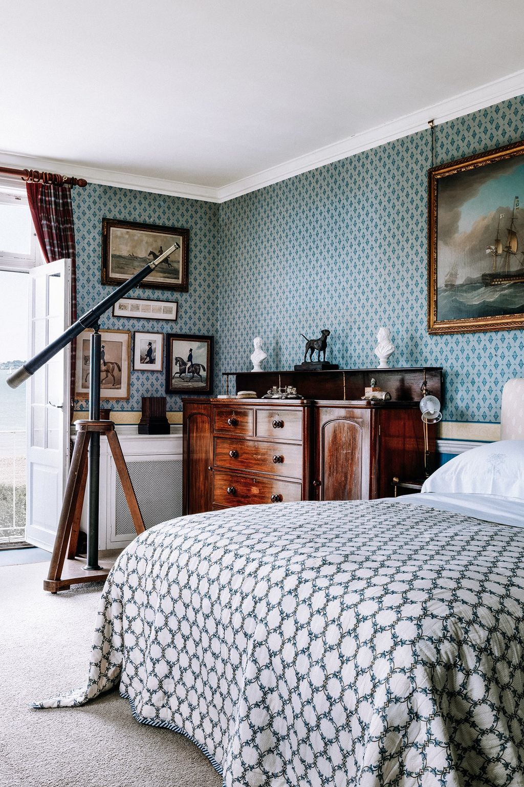 Image may contain Furniture Bed Tripod Indoors Room Interior Design Bedroom and Rug