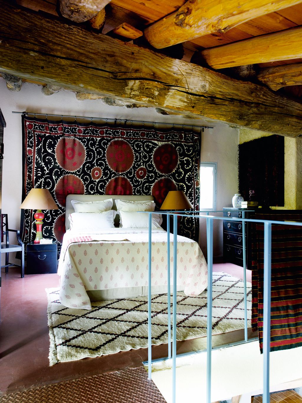 Image may contain Interior Design Indoors Room Bedroom Living Room Lamp Table Lamp Housing Building and Furniture