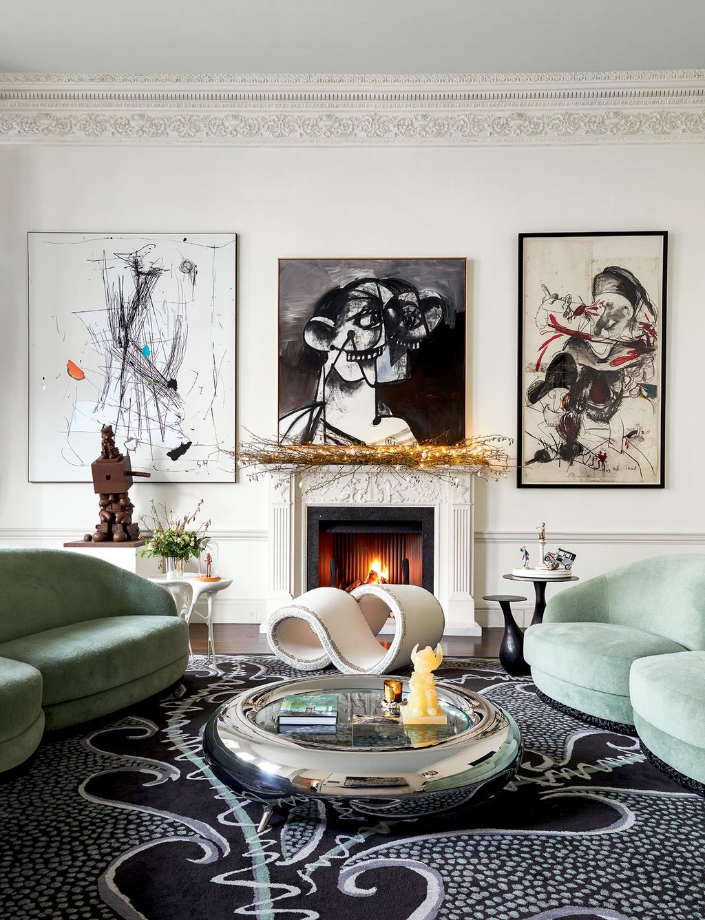 Image may contain Furniture Living Room Indoors Room Rug Table Couch Coffee Table Art and Interior Design