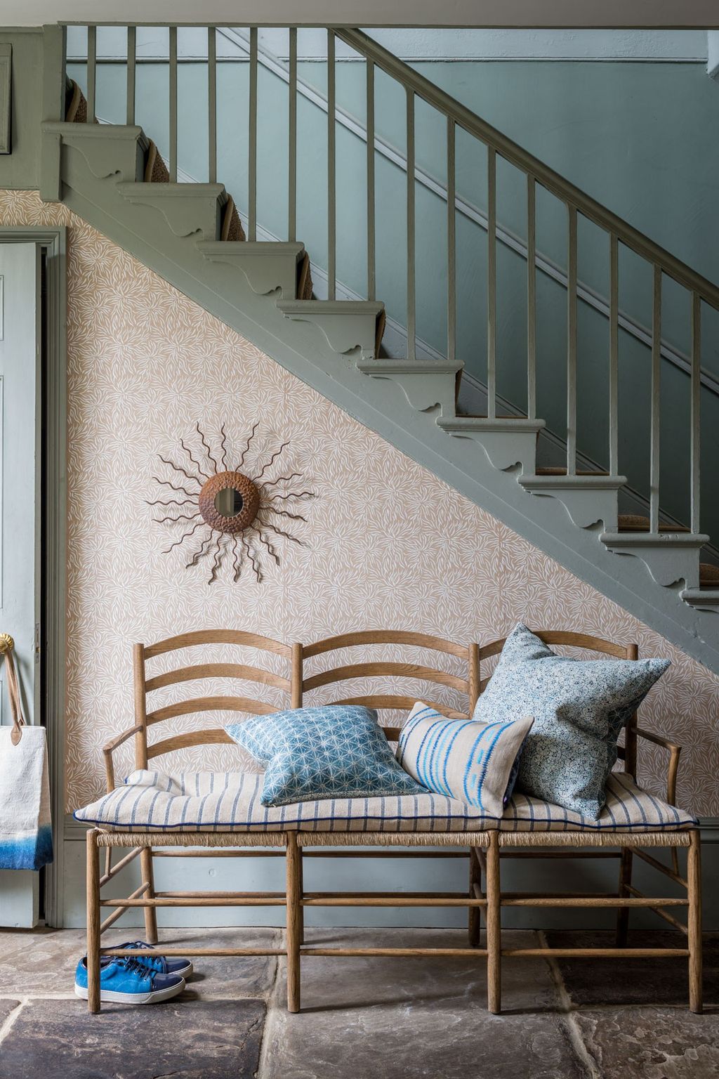 Image may contain Banister Handrail Interior Design Indoors Cushion Pillow Wood Hardwood Staircase and Room